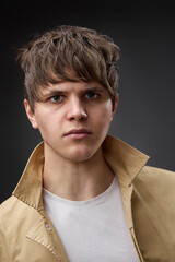 portrait of caucasian man with hairstyle in coat