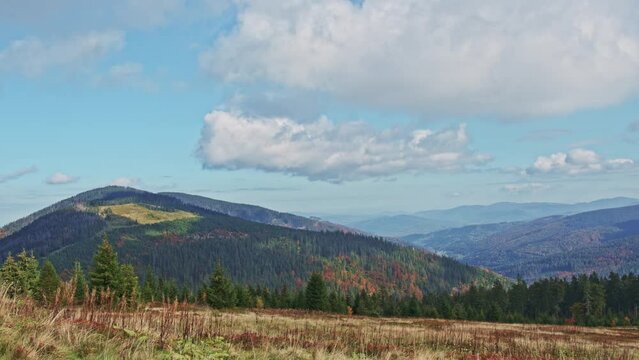 Beautiful autumn mountain landscape. Autumn colors. A view of the "Romanka" mountain massif and a beautiful mountain valley. Rysianka, Poland. 4k time lapse