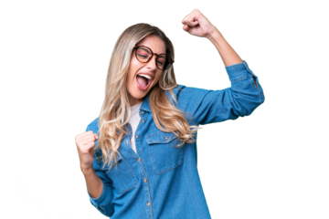 Young Uruguayan woman over isolated background celebrating a victory