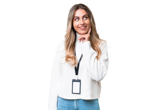 Young Uruguayan woman with ID card over isolated background thinking an idea while looking up