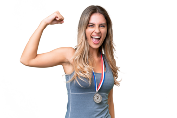 Young pretty sport Uruguayan woman with medals over isolated background doing strong gesture
