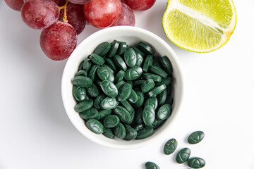 Spirulina is a useful supplement. on a white background
