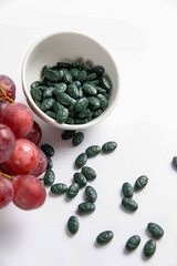 Spirulina is a useful supplement. on a white background
