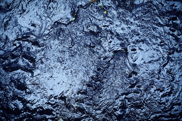 Forest creek with waterfalls. Water cascades over rocks. blue and crystal clear water in mountain river.