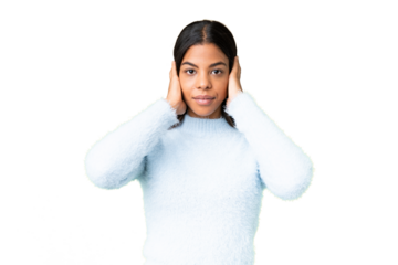 Young African American woman over isolated chroma key background frustrated and covering ears