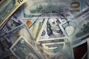 Group of money stack of 100 US dollars banknotes a lot of the background texture. Cash money in a large pile as a finance background.