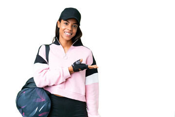 Young sport African American woman with sport bag over isolated chroma key background presenting an idea while looking smiling towards