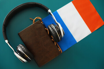 Headphones and flag. The study of foreign subjects. Audiobooks in a foreign language. Language...