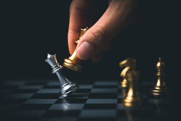 ฺbusinesswoman moves chess in a successful match Planning strategy, teamwork, management, leadership or business success concept.