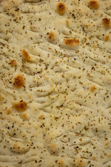 Italian bread - Focaccia, on a wooden table
