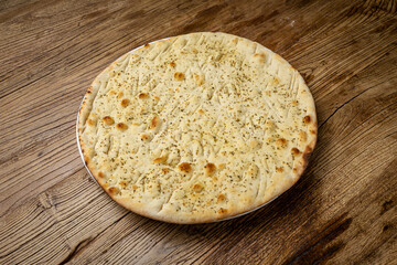 Italian bread - Focaccia, on a wooden table
