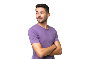 Young handsome caucasian man over isolated background looking to the side and smiling