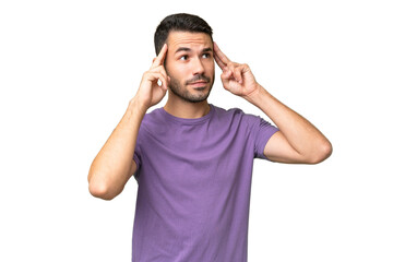 Young handsome caucasian man over isolated background having doubts and thinking