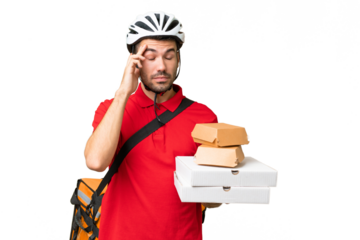 Young handsome caucasian man with thermal backpack and holding takeaway food over isolated background with headache