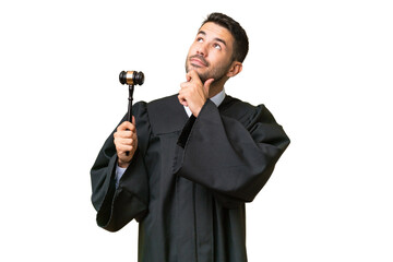 Naklejka premium Judge caucasian man over isolated background and looking up