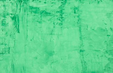 Abstract background from damaged green plaster.