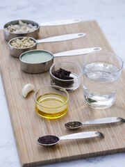 Mise en place on wooden board for high culinary raw vegan cuisine 