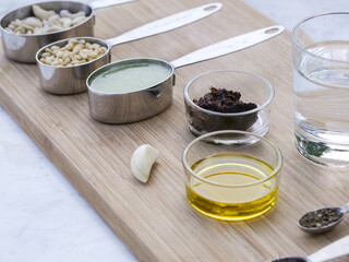 Mise en place on wooden board for high culinary raw vegan cuisine 