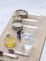 Mise en place on wooden board for high culinary raw vegan cuisine 