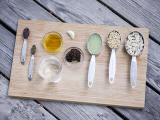 Mise en place on wooden board for high culinary raw vegan cuisine 