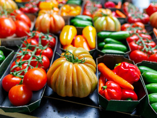 Fresh organically grown tomatoes and cucumbers at the farmers market