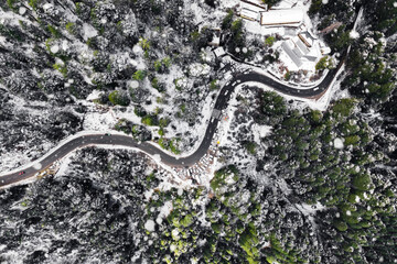 Snowy Aerial picture of road and forest in winter, Drone photo