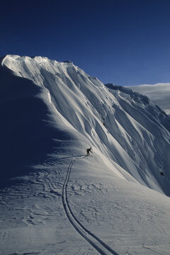 skier probing a cornice in Haines, Alaska