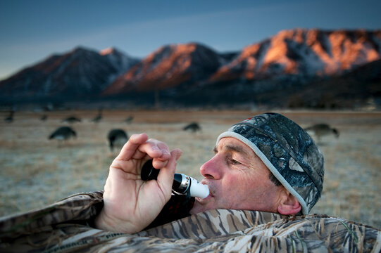 A hunter uses a call to lure geese in Nevada.