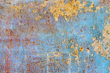 Old cracked paint in craquelure on a rusty metal surfaceGrunge rusted metal texture. Rusty corrosion and oxidized background. Worn metallic iron rusty metal background.