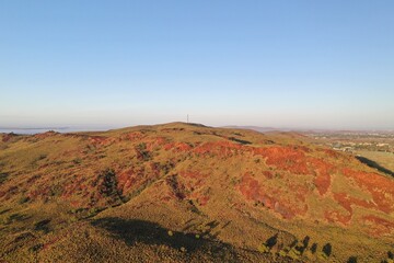 Fototapeta na wymiar An aerial view of the red soil mountain