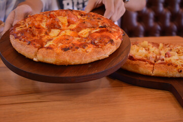 The yellow pizza is on the tray. looks delicious