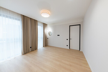 clean large bright room with white walls and lighting