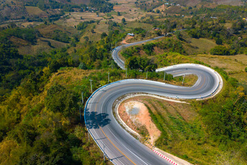 Top view Aerial photo from flying drone over Mountains and winding mountain paths exciting steep at Phu Kao Ngom,Na Haeo City,Loei Province,Thailand,ASIA.