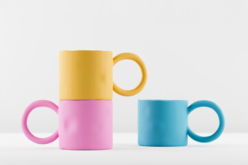 Mockups of three multicolored handmade clay cups on white background.