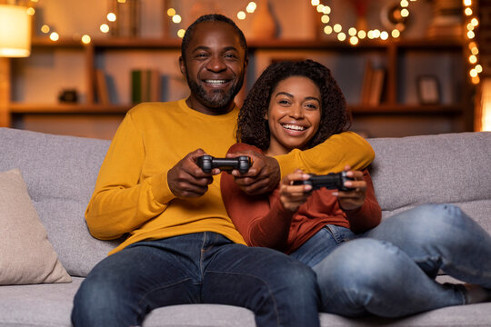 Happy Black Lovers Playing Video Games At Home