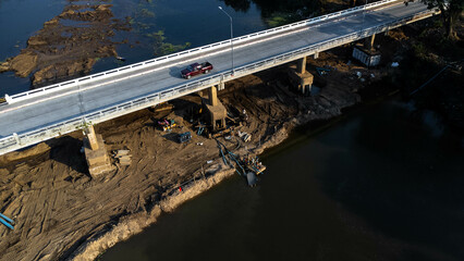 Aerial view of renovation and repair work on the river bridge road.