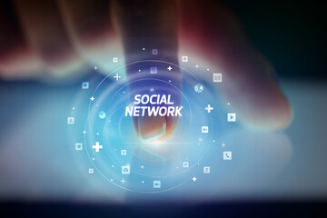Finger touching tablet with social media icons concept
