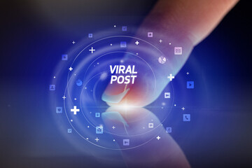 Finger touching tablet with social media icons concept