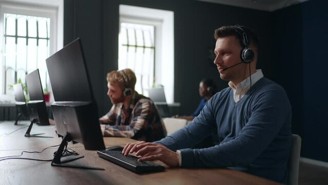 round-the-clock call-center, portrait of male technical support specialist consulting customers