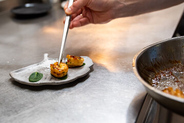 man chef cooking fried shrimp on kitchen