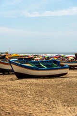 Fototapeta premium fishing boat next to the beach in the sand of a very large size and typical of the region