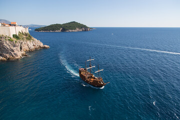 Old wooden three-master ship on the blue adriatic sea - passing Dubrovnik, Croatia