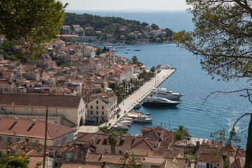 View from the ancient Spanish Fortress to the harbor with its paved promenade and the old town of Hvar, Dalmatia, Croatia