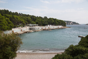 View from the Bonj beach to a beach club on the island Hvar, Croatia