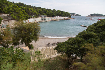 View from the Bonj beach to a beach club on the island Hvar, Croatia