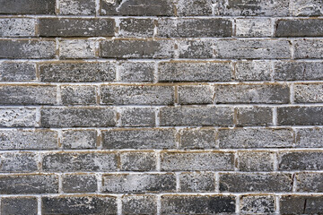 Close-up of gray and white brick wall at City of Zürich district Schwamendingen on a cloudy winter day. Photo taken January 29th, 2023, Zurich, Switzerland.