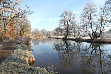 A still River Wey on a cold frosty morning, Surrey, UK.