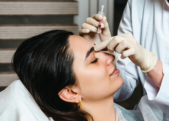 Fototapeta premium Botox injections to prevent facial wrinkles
