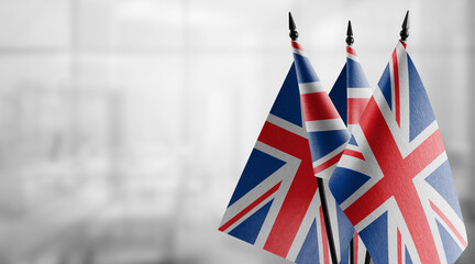 Small flags of the United Kingdom on an abstract blurry background