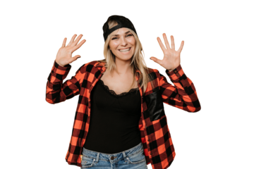 Pretty blonde in baseball cap and checked shirt , broad smiling, shows her palms, posing over transparent background with a copy space for ad. She is ready to celebrate. Happiness concept.